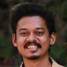 Sangeeth Prathap smiling in a printed shirt, close-up portrait