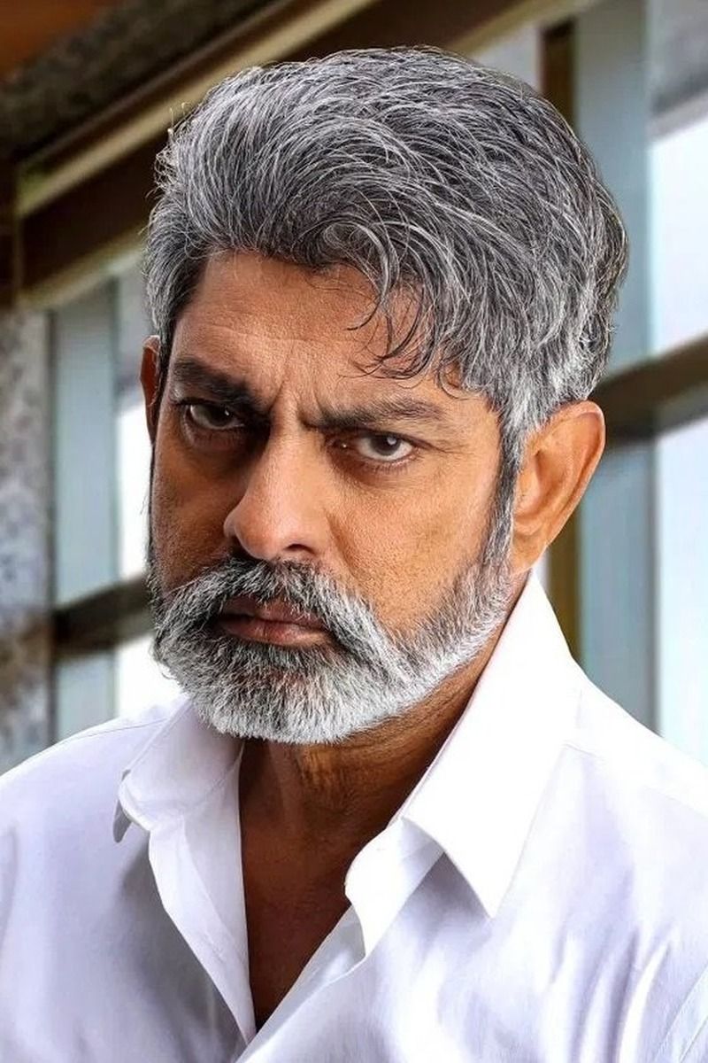 Jagapathi Babu with grey hair and beard in a white shirt