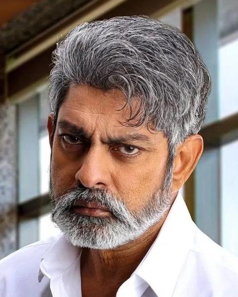 Jagapathi Babu with grey hair and beard in a white shirt