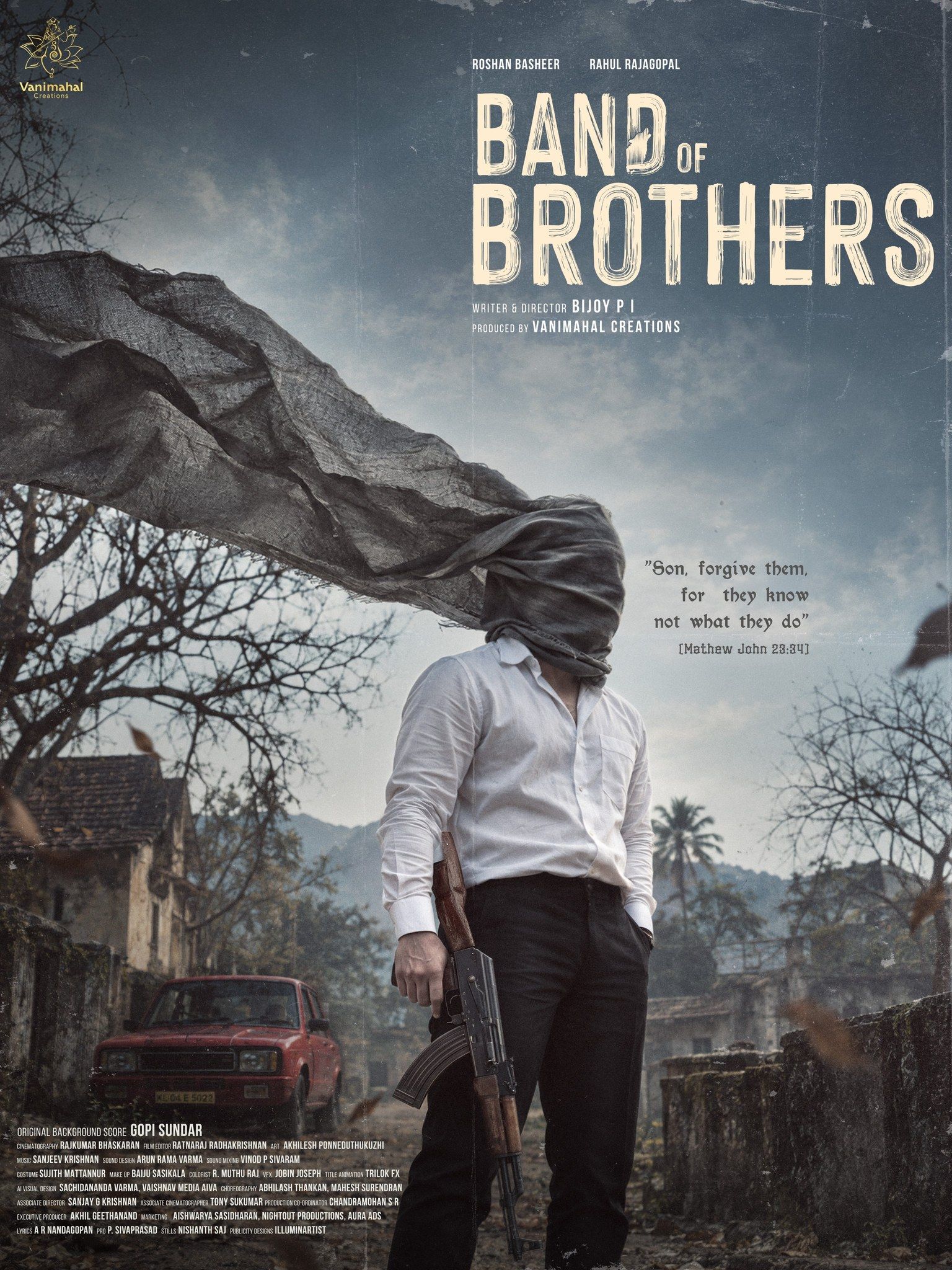 Band of Brothers first-look poster showing a man in a white shirt with his face wrapped in grey cloth, holding a rifle in a deserted village