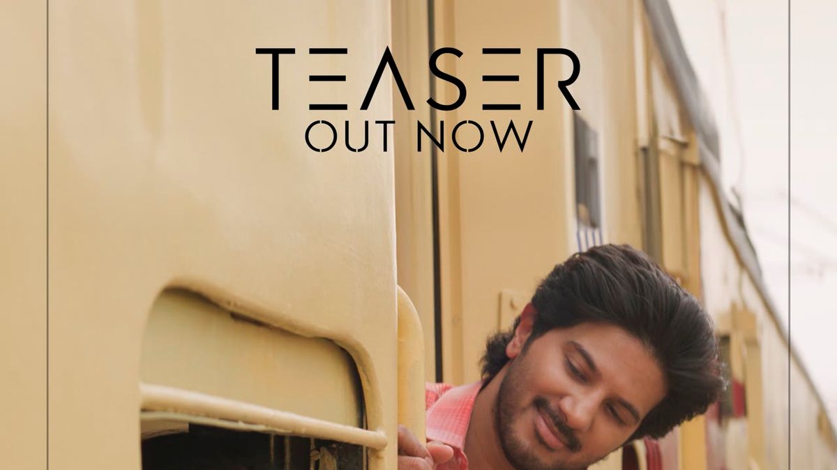 Dulquer Salmaan leaning out of a train window on the Aakasamlo Oka Tara poster
