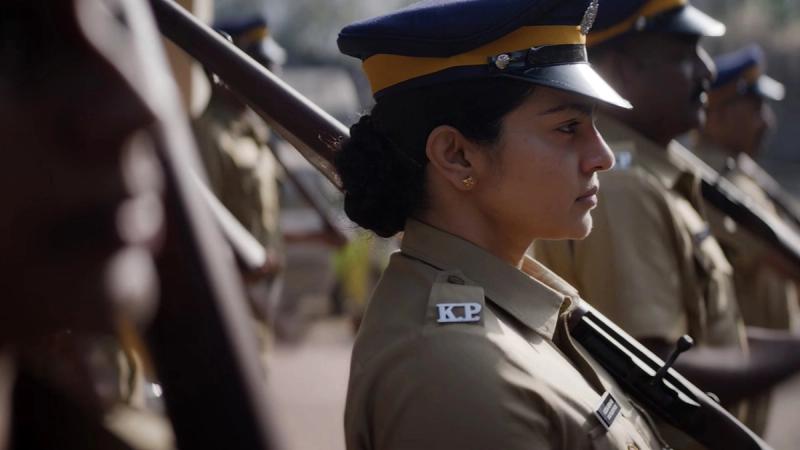 Parvathy Thiruvothu in Kerala Police uniform and cap in a Pradhama Drishtya Kuttakkar still
