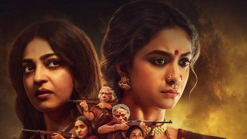 Akka trailer key art with Radhika Apte and Keerthy Suresh above a group of women holding rifles