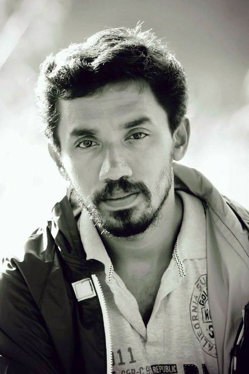 Midhun Manuel Thomas with a beard, black and white portrait