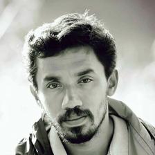 Midhun Manuel Thomas with a beard, black and white portrait