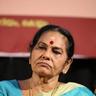 KPAC Lalitha in a blue saree with a red bindi at an event