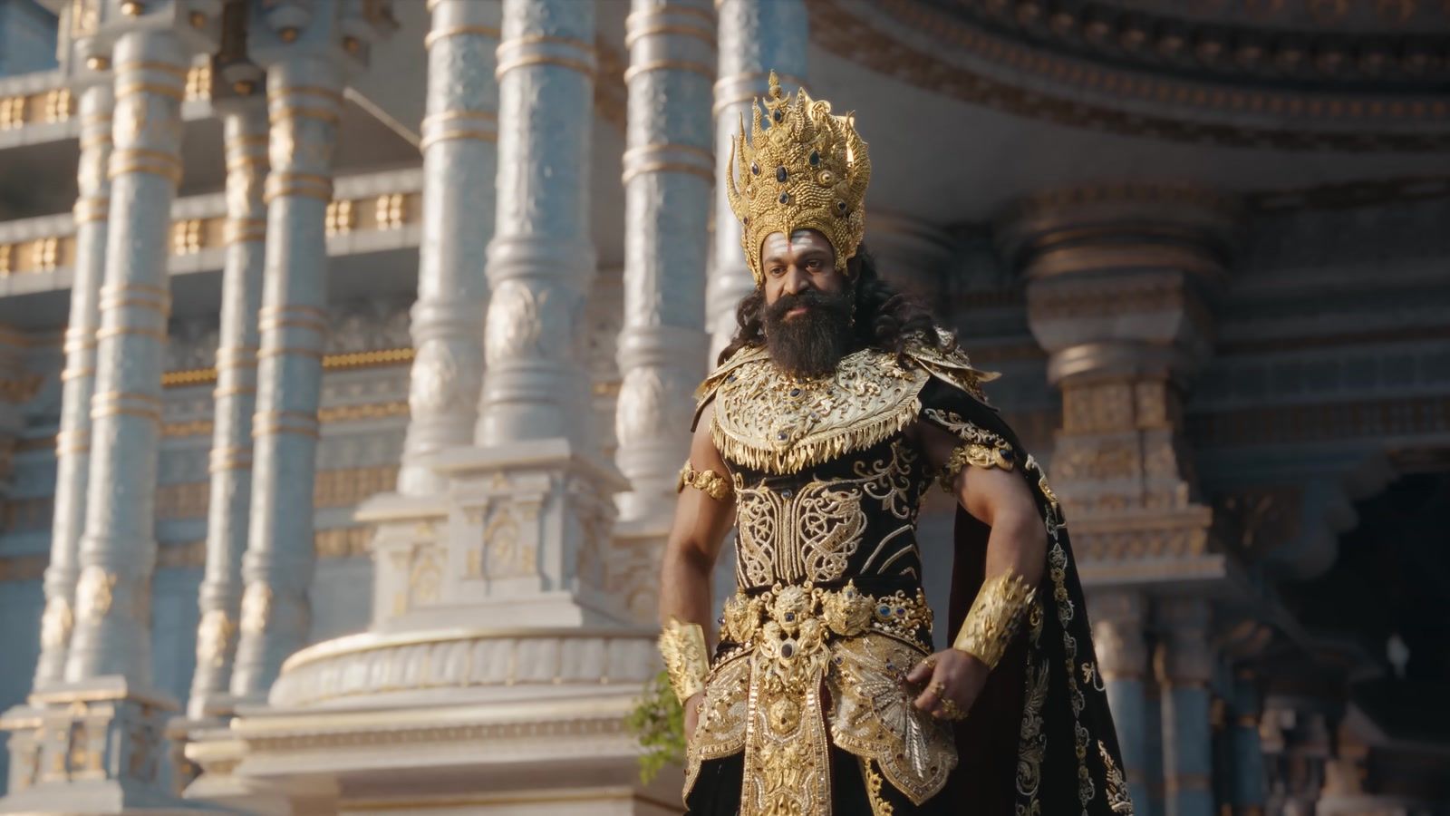 A crowned king in front of a palace in a frame from the Ramayana Malayalam trailer