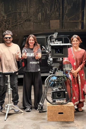 SlumDog – 33 Temple Road cast and crew giving a thumbs-up beside a cinema camera at the end of the shoot