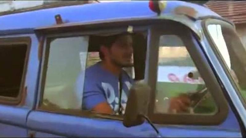 Dulquer Salmaan driving a blue van in the Ustad Hotel trailer