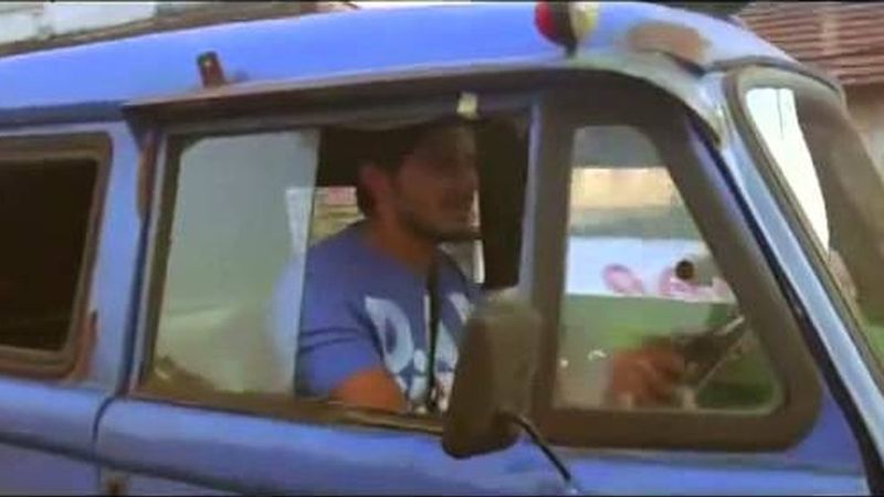 Dulquer Salmaan driving a blue van in the Ustad Hotel trailer
