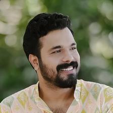Abhiram Radhakrishnan smiling in a pastel ikat-print kurta, head-and-shoulders portrait
