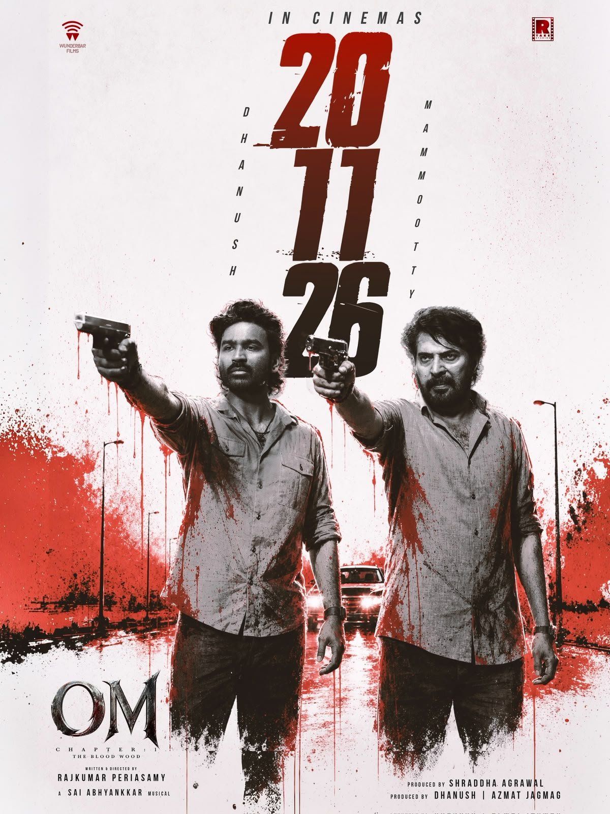 Dhanush and Mammootty holding guns in the OM release date poster
