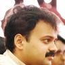Kunchacko Boban with a moustache looking to the side, close-up portrait