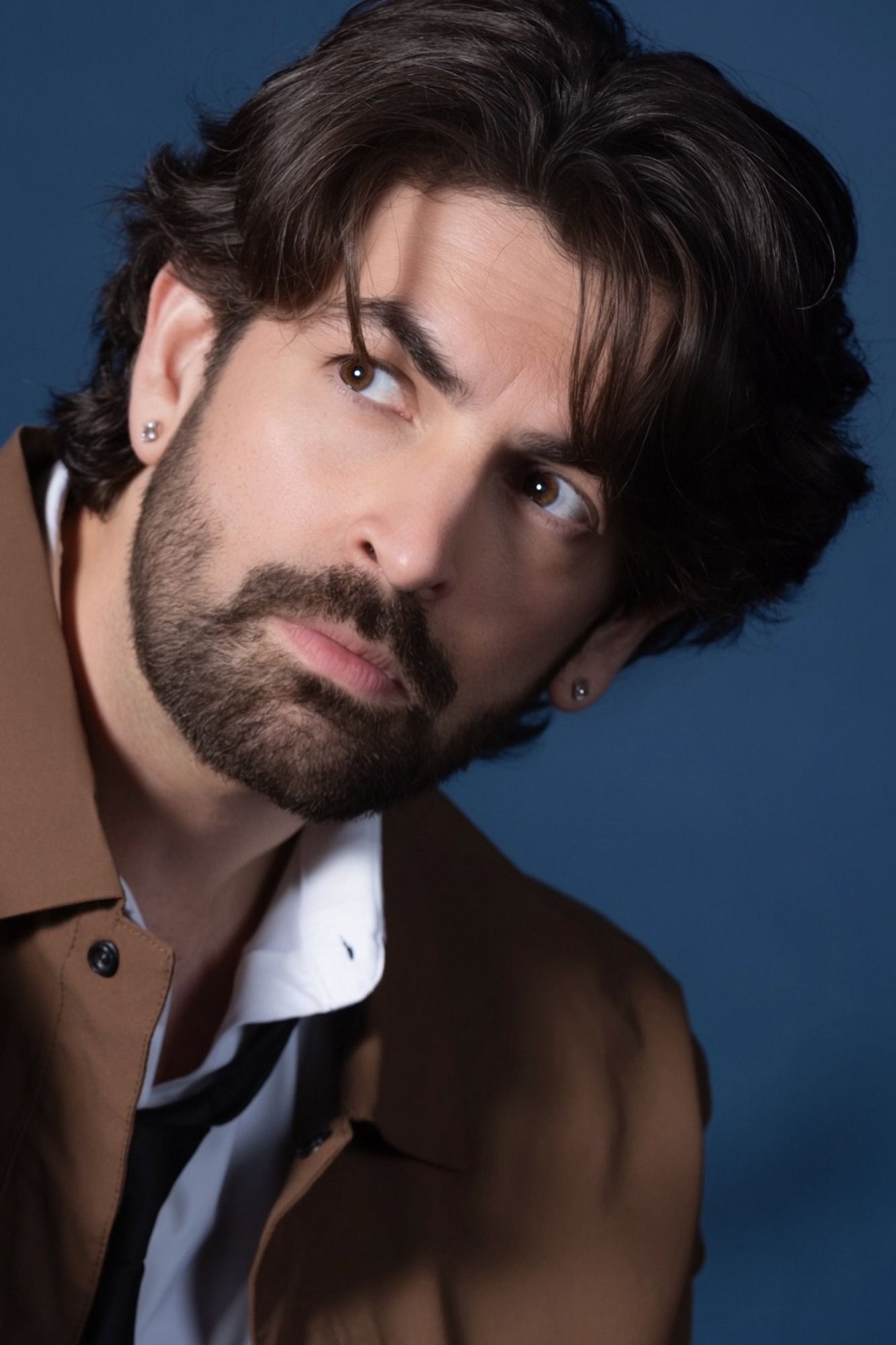 Neil Nitin Mukesh with tousled hair and a beard, portrait