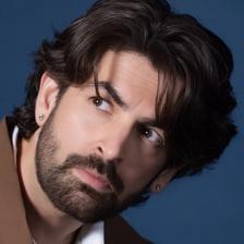 Neil Nitin Mukesh with tousled hair and a beard, portrait