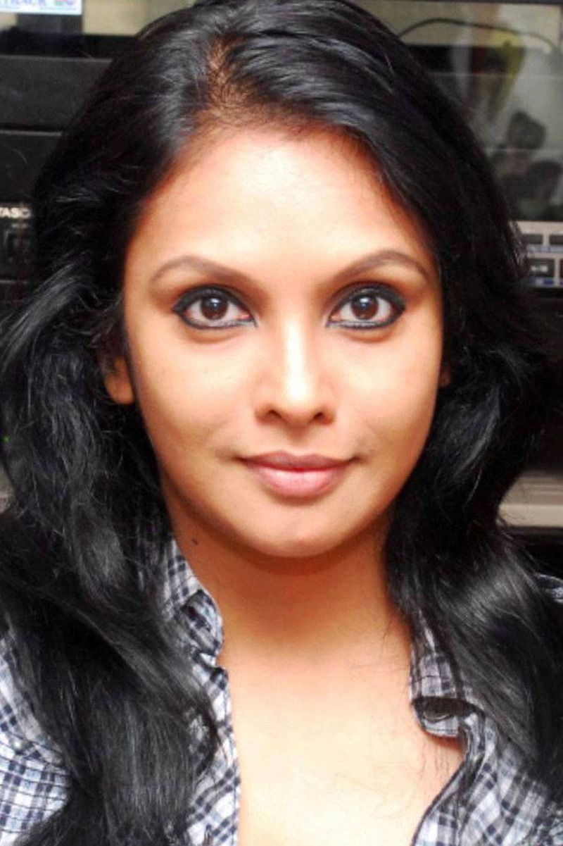 Jyothirmayi with long dark hair looking at the camera, close-up portrait