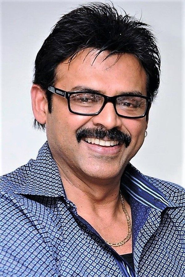 Venkatesh smiling in glasses and a checked shirt, portrait