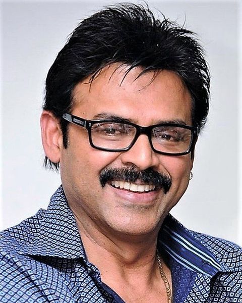 Venkatesh smiling in glasses and a checked shirt, portrait