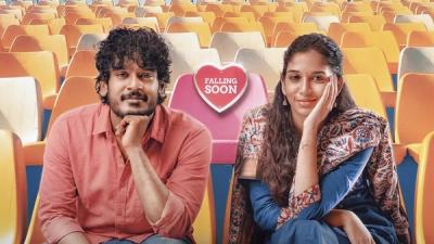 Aegan and Sri Devi Apalla smiling side by side in orange stadium seats beside a Falling Soon heart sign, Haiku poster