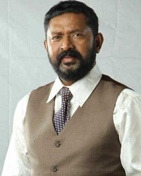 Lal with a beard in a waistcoat and tie, portrait
