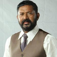 Lal with a beard in a waistcoat and tie, portrait