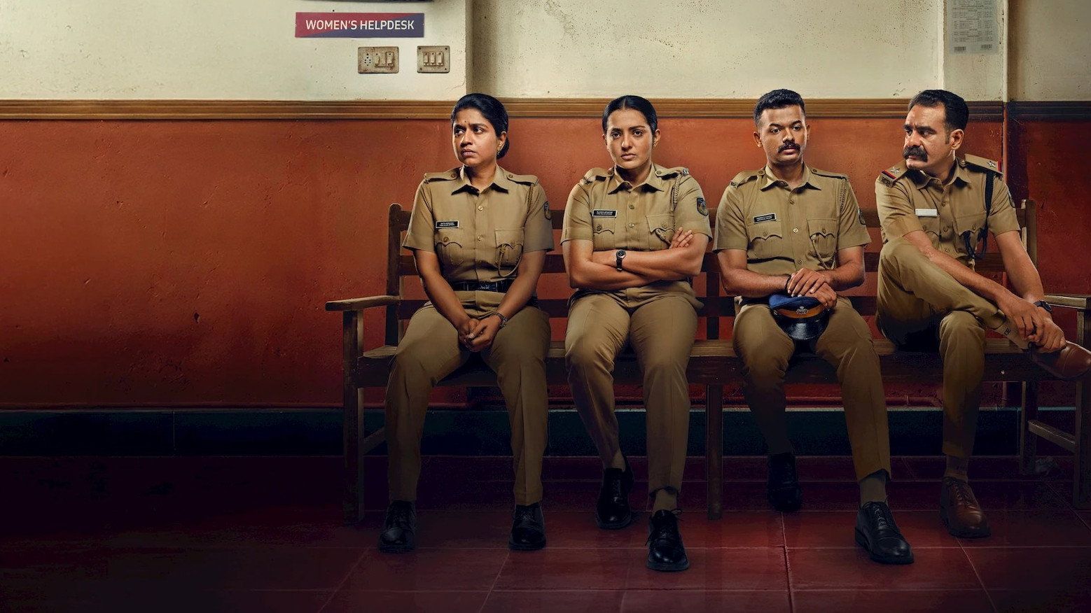 Pradhama Drishtiya Kuttakkar still of four police officers seated on a station bench