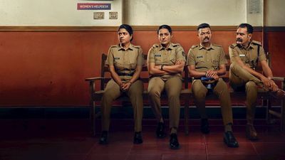 Pradhama Drishtiya Kuttakkar still of four police officers seated on a station bench