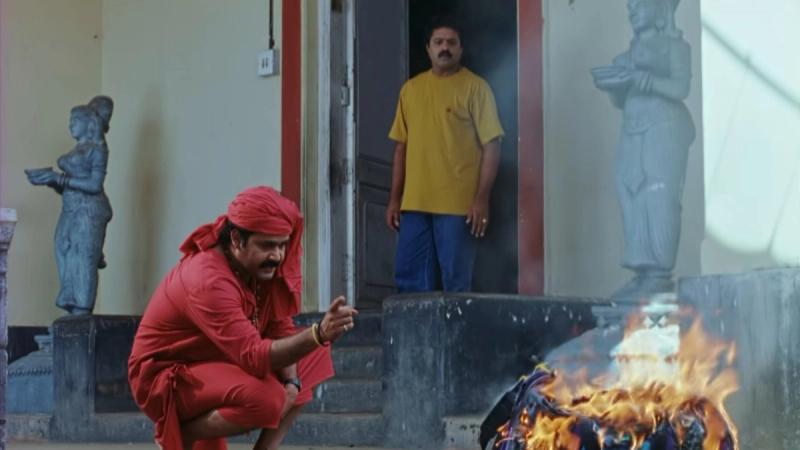 Mohanlal as Dr Sunny by a fire as Suresh Gopi watches in the Manichitrathazhu 4K teaser