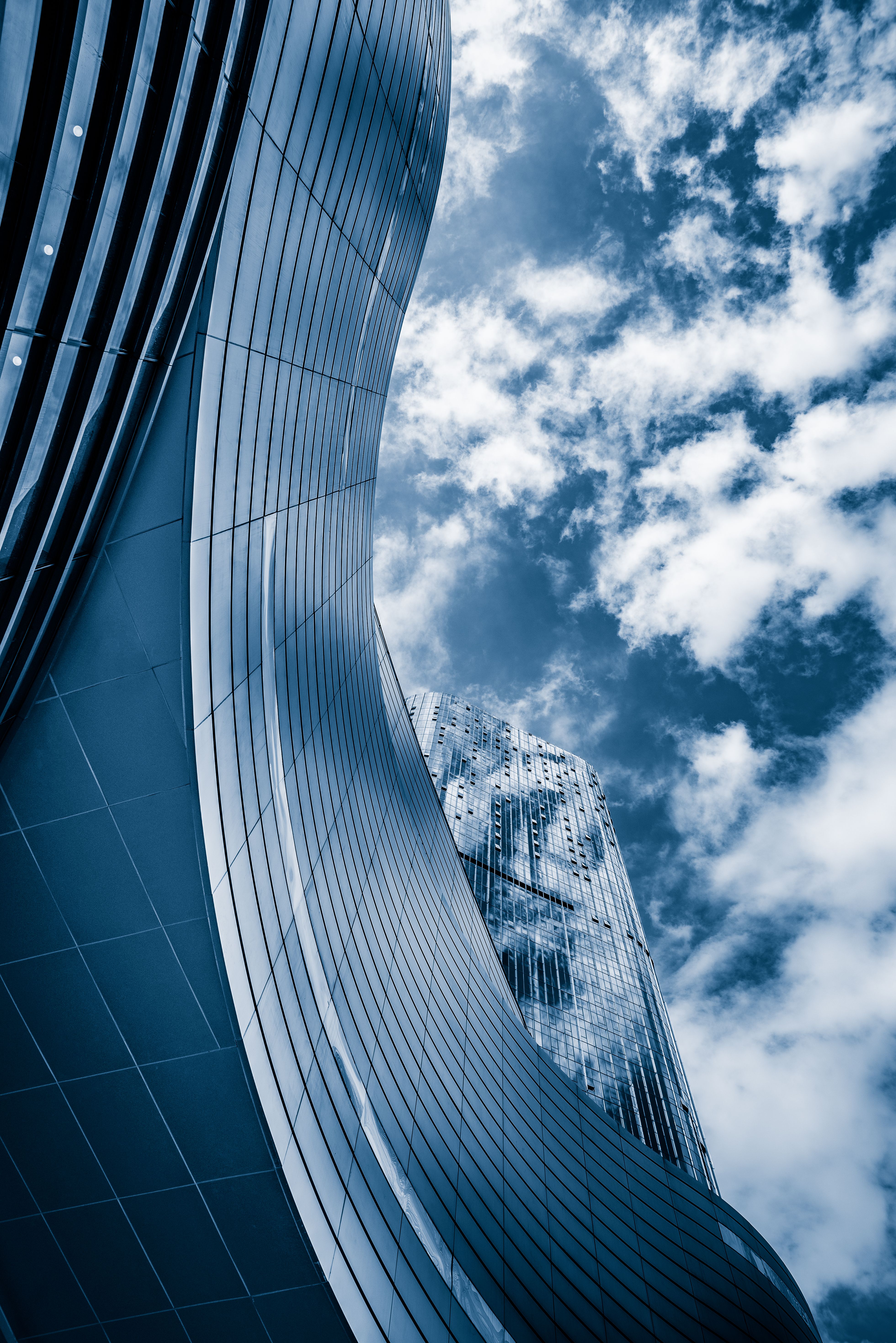 Modern glass skyscrapers against a clear sky