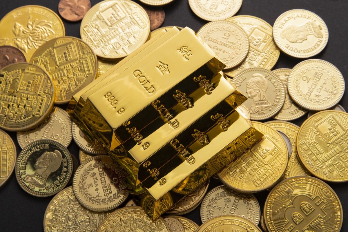 Gold bars on a pile of gold coins