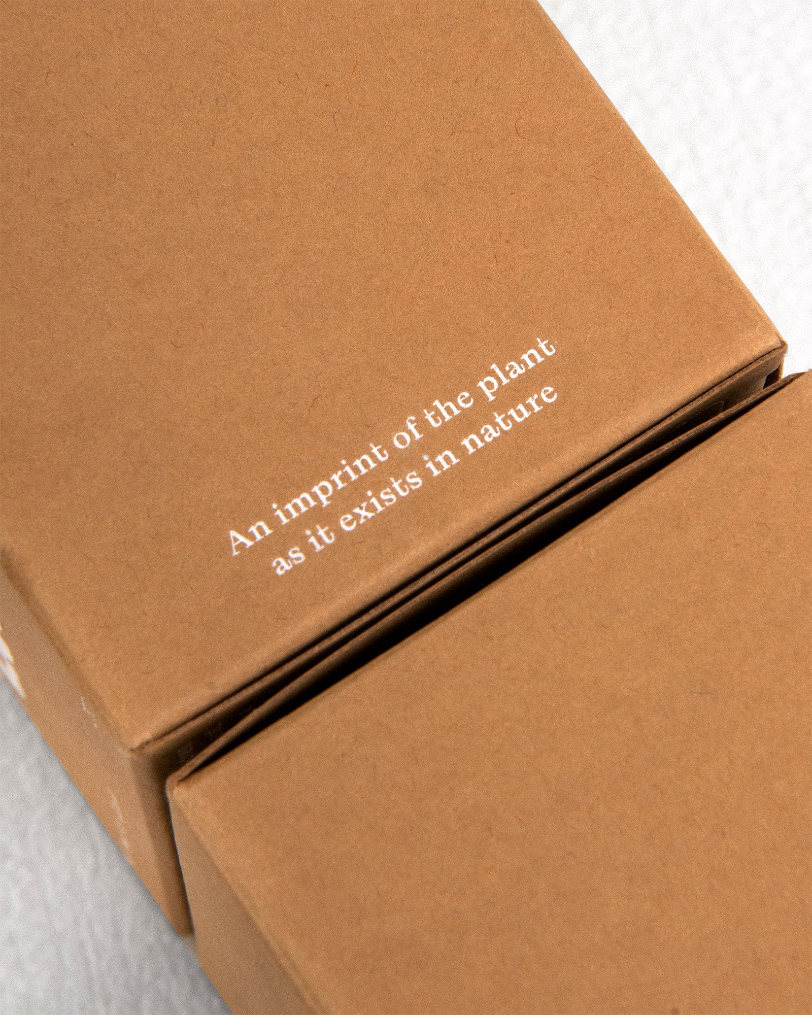 Rose caps outside packaging "an imprint of the plant as it exists in nature"