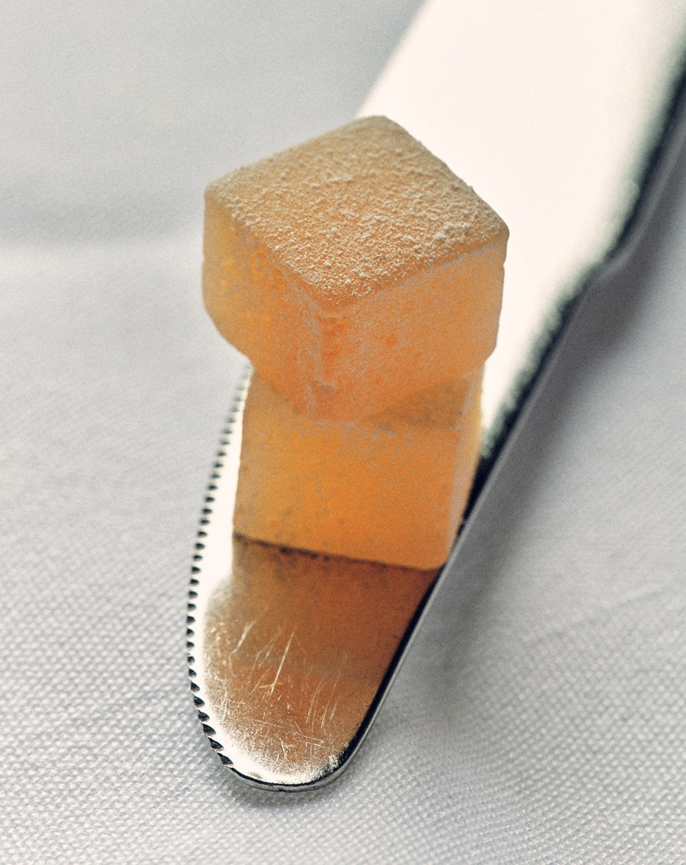 Two Rose Delights stacked on a butter knife.