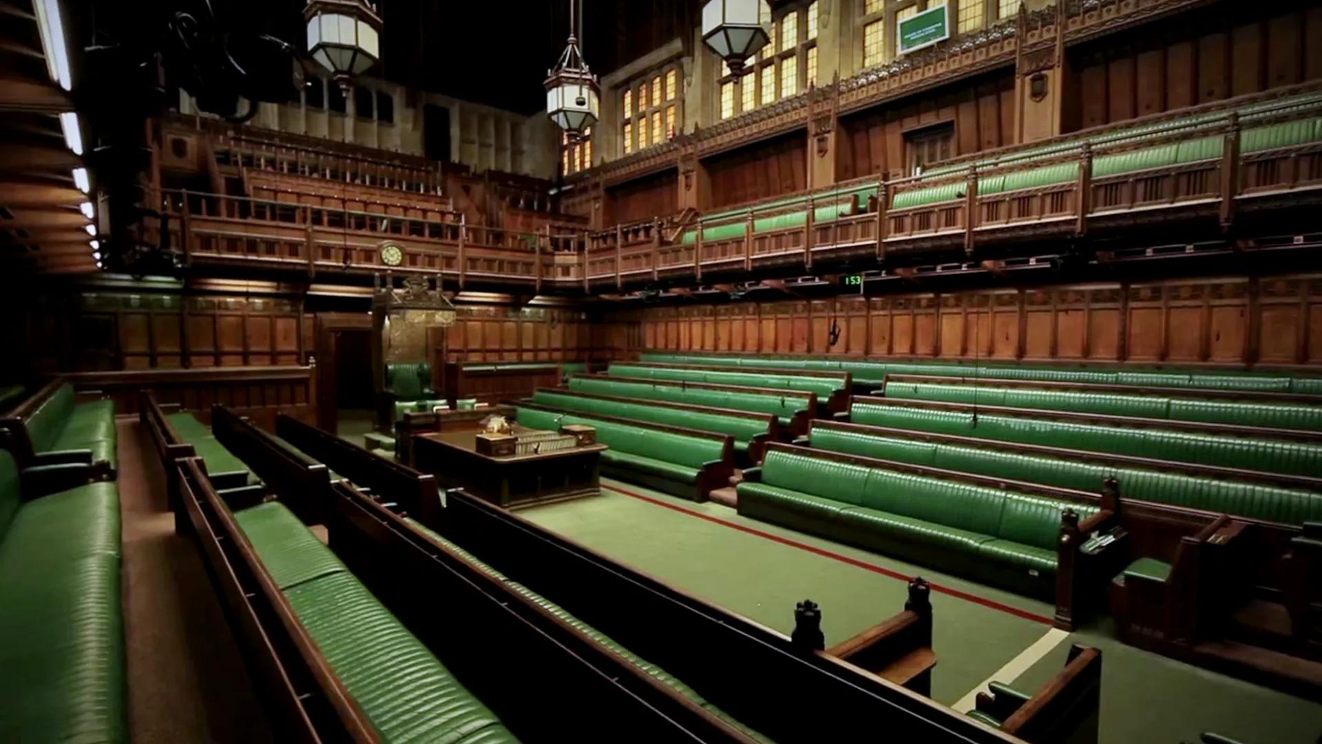 The green benches and central dispatch boxes inside the House of Commons chamber.