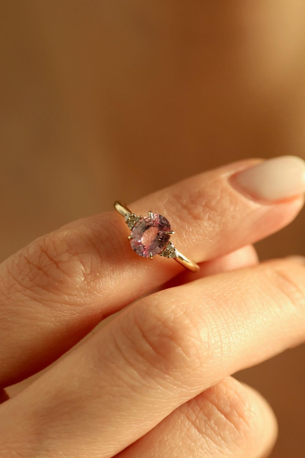 Pink sapphire ring set in yellow gold with sprinkled lab-grown diamonds