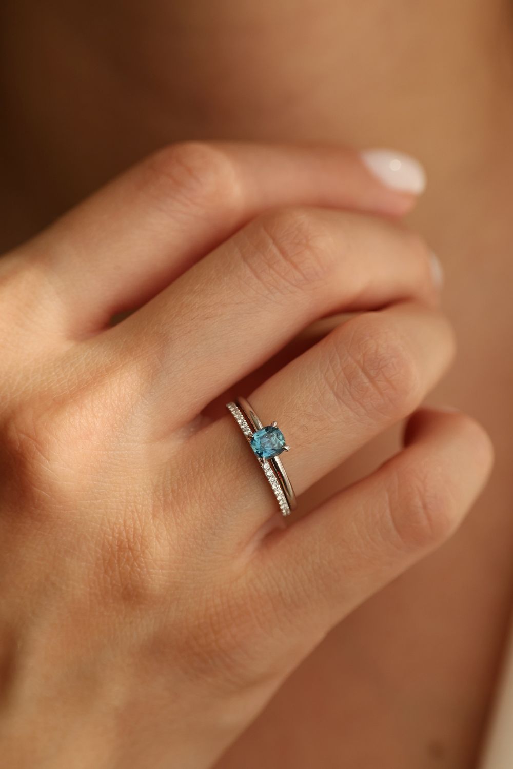 Blue emerald cut sapphire with diamonds band set in 14K yellow gold