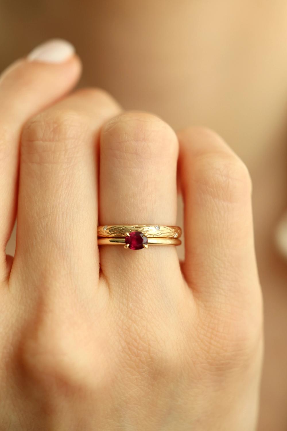 red ruby ring set in yellow gold