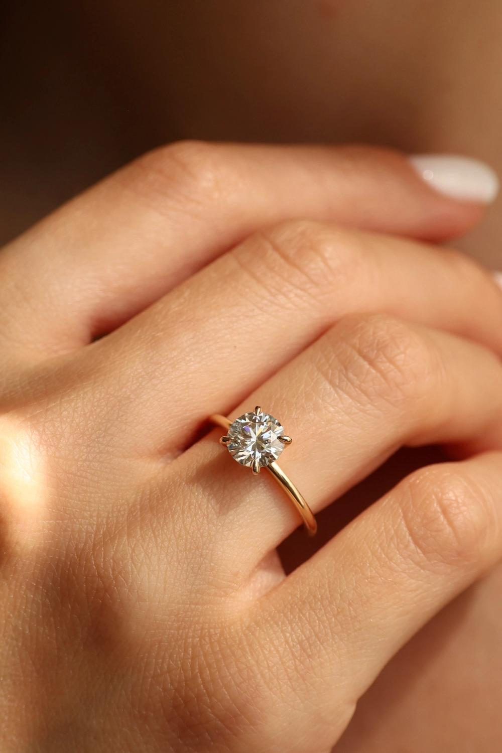 Round lab-diamond four prongs set in 14K yellow gold