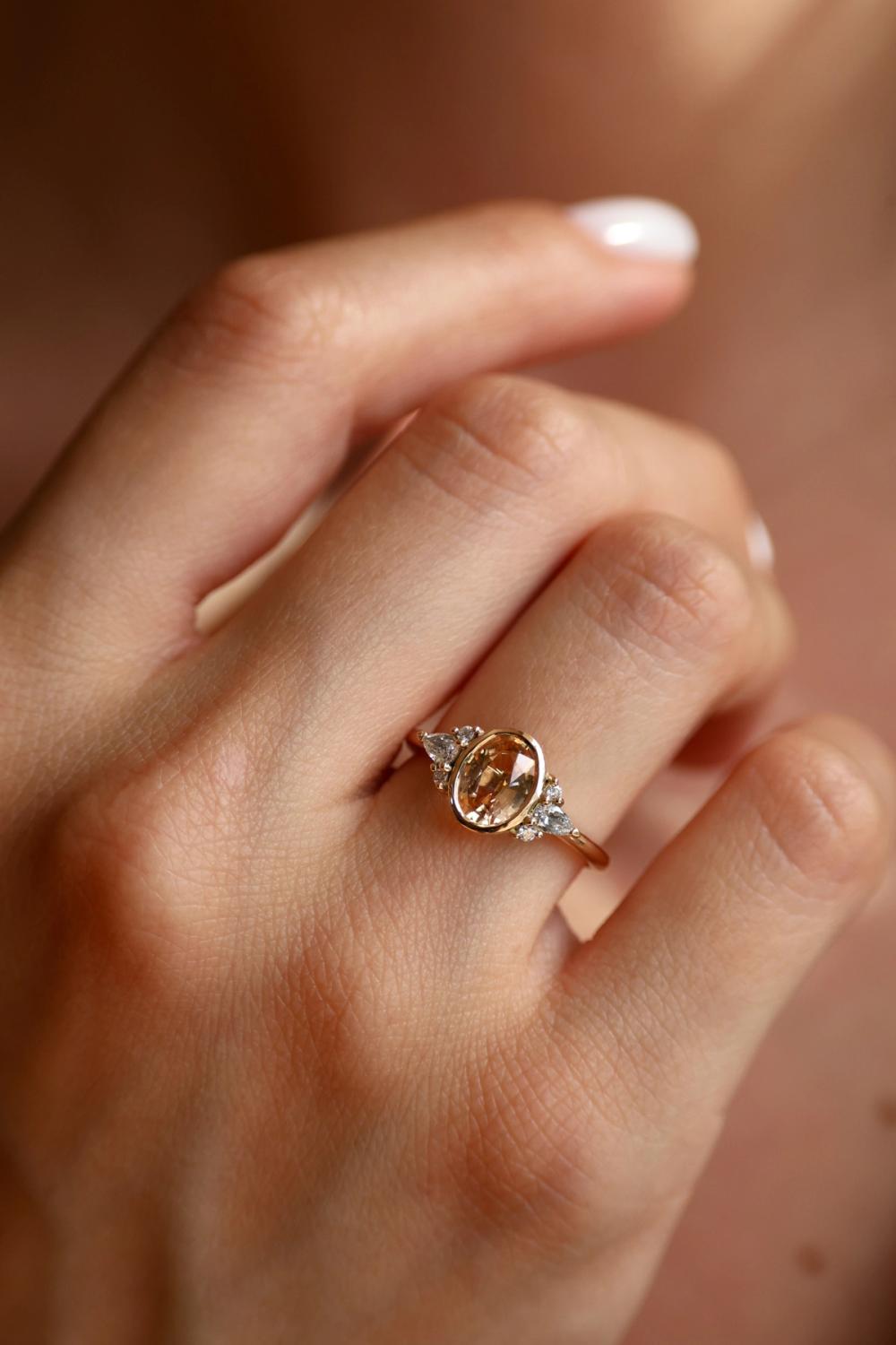 Nangi Peach Blush Oval Sapphire Ring & Sprinkled Diamonds