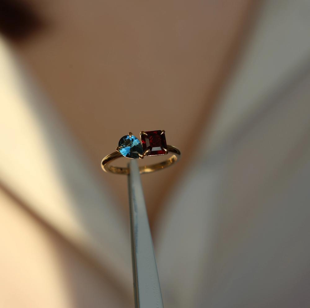 blue topaz red garnet colored gemstone ring yellow gold
