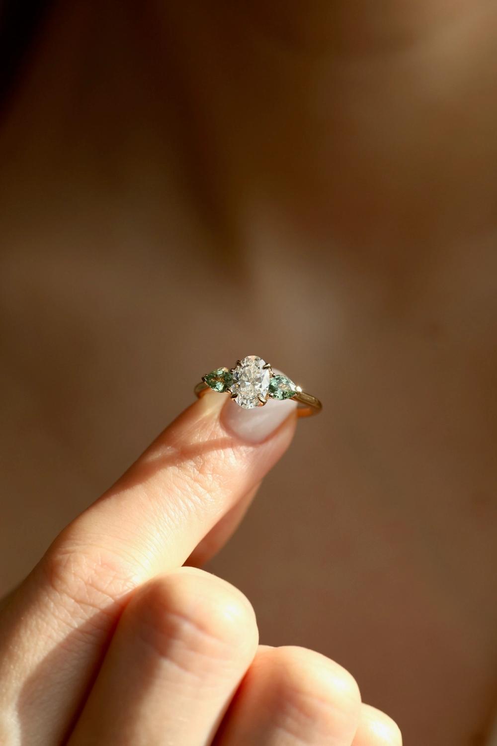 Nangi floral diamond ring with green sapphires