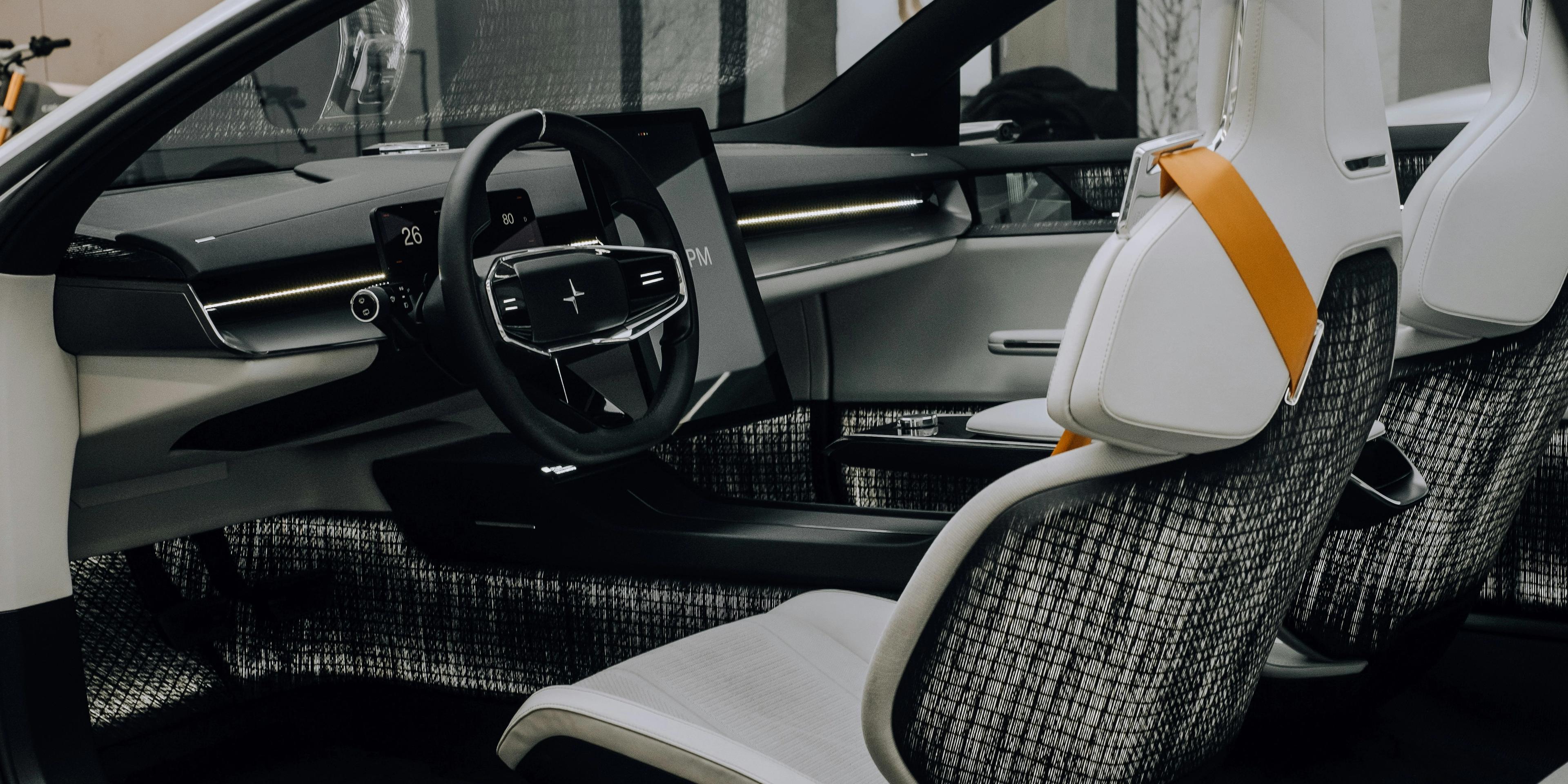 Polestar moder EV interior with white sporty bucket seats