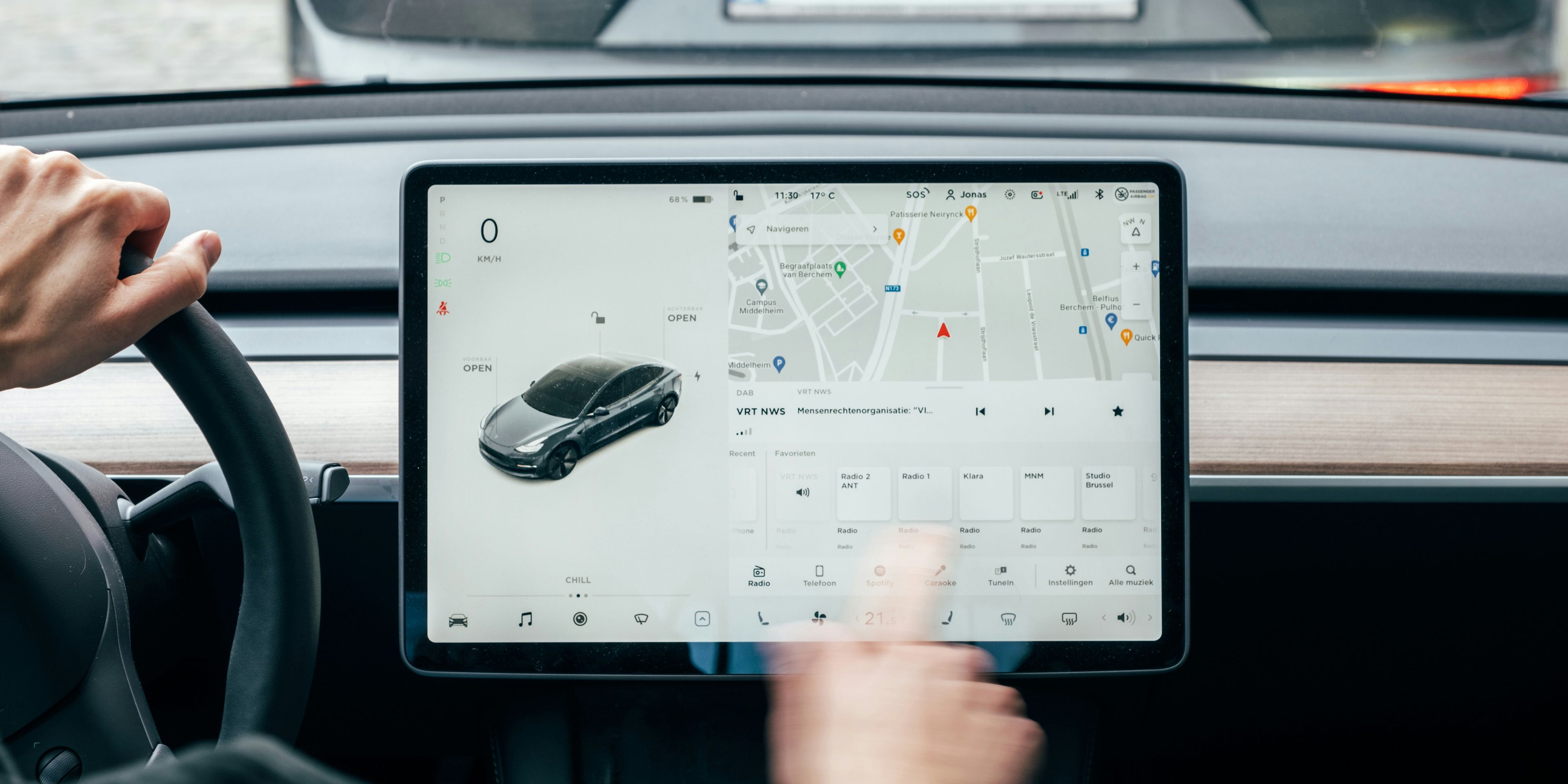 Tesla car with black screen and Grok logo in the middle