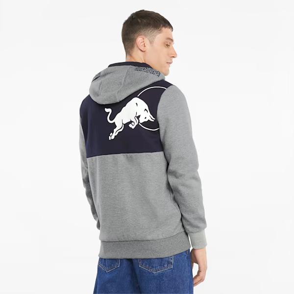 Man in a navy and grey Red Bull hoodie, seen from behind.