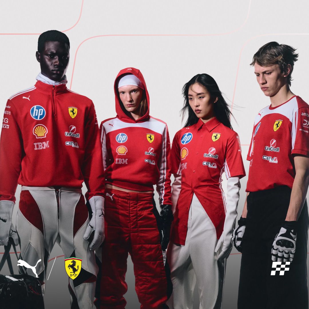 Four models in red and white Ferrari-branded racing-inspired outfits with sponsor logos.