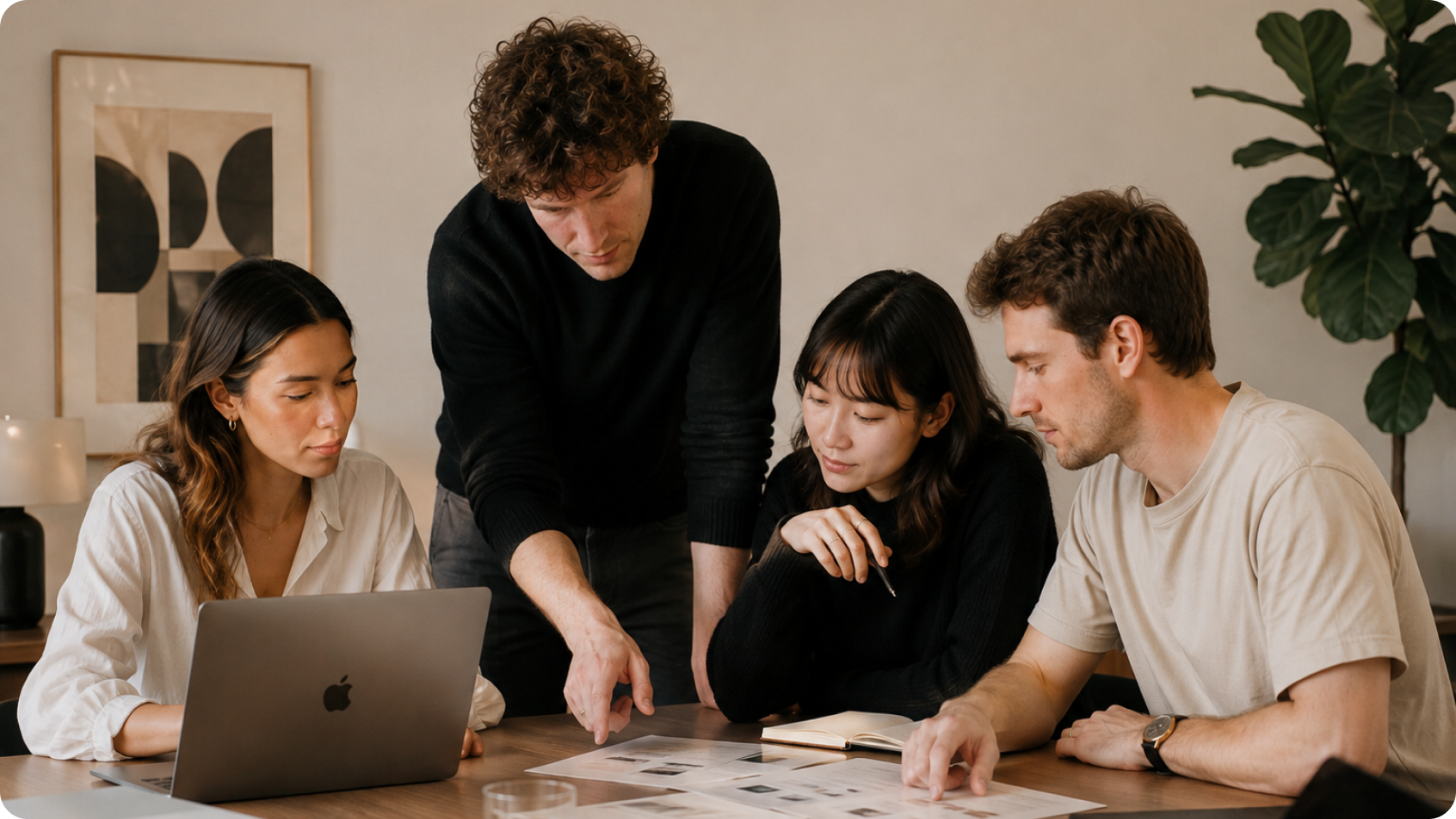 The Equs team around a laptop