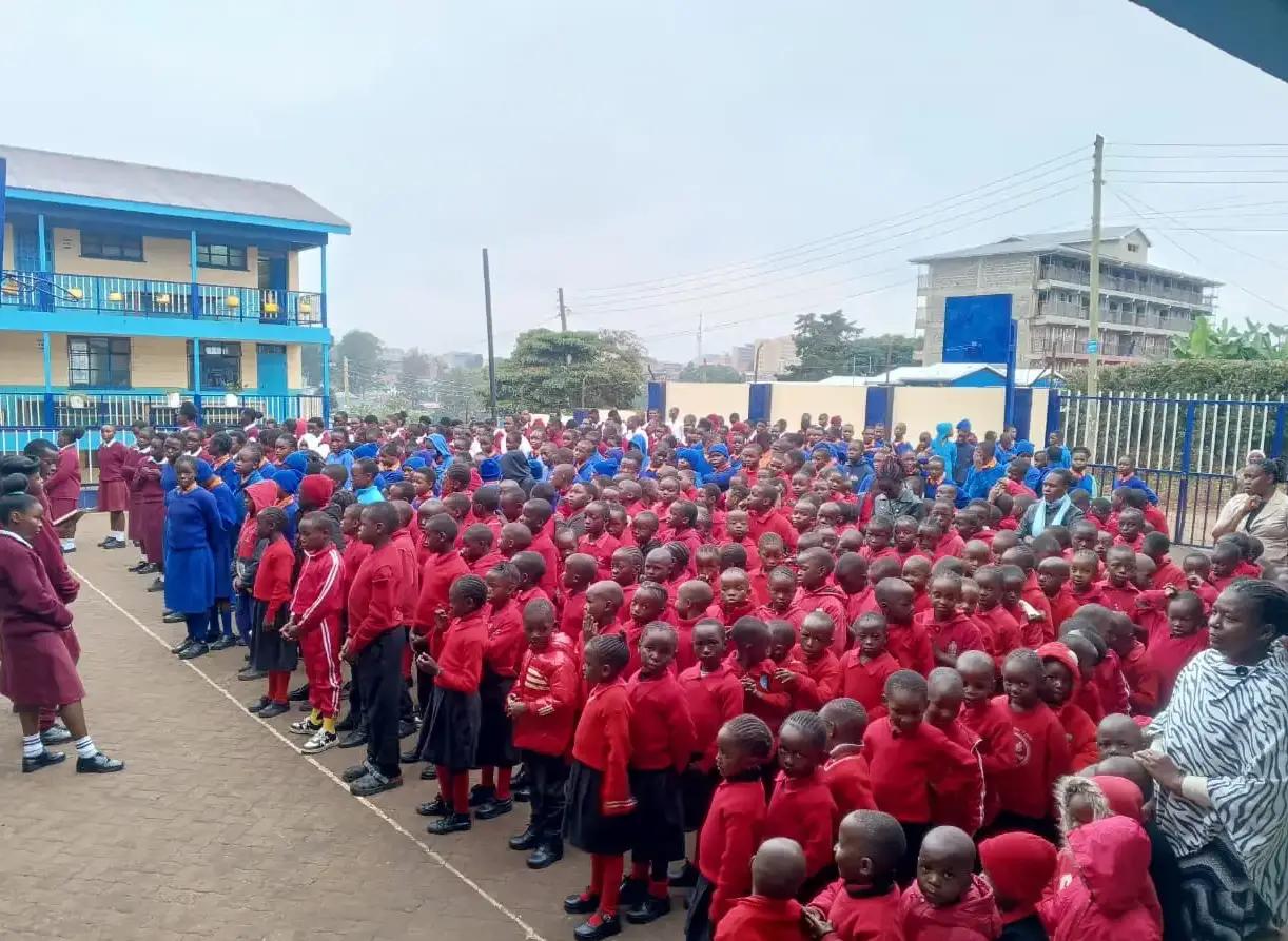 The school community gathered in the courtyard.
