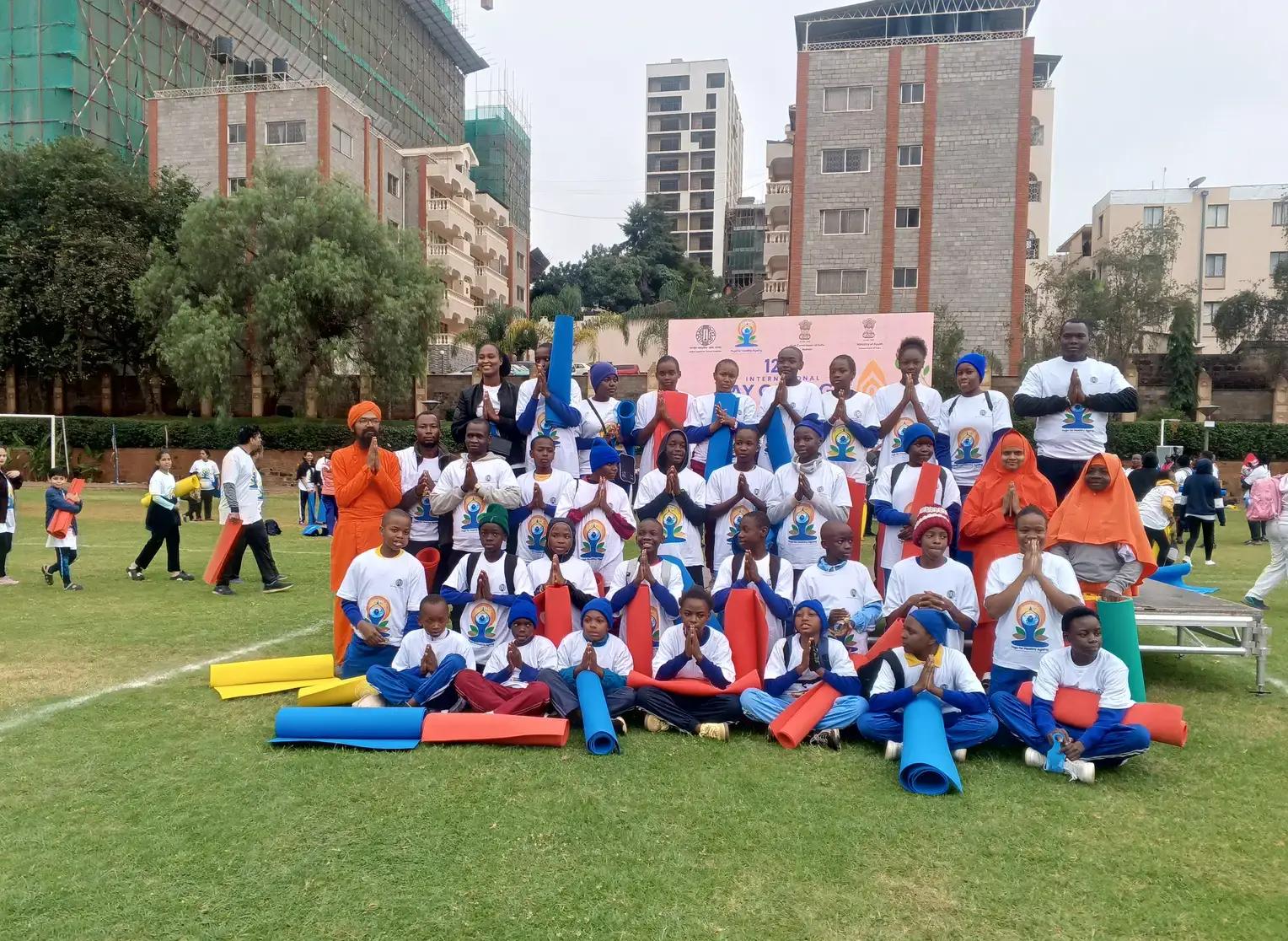 The school group at a community yoga gathering.