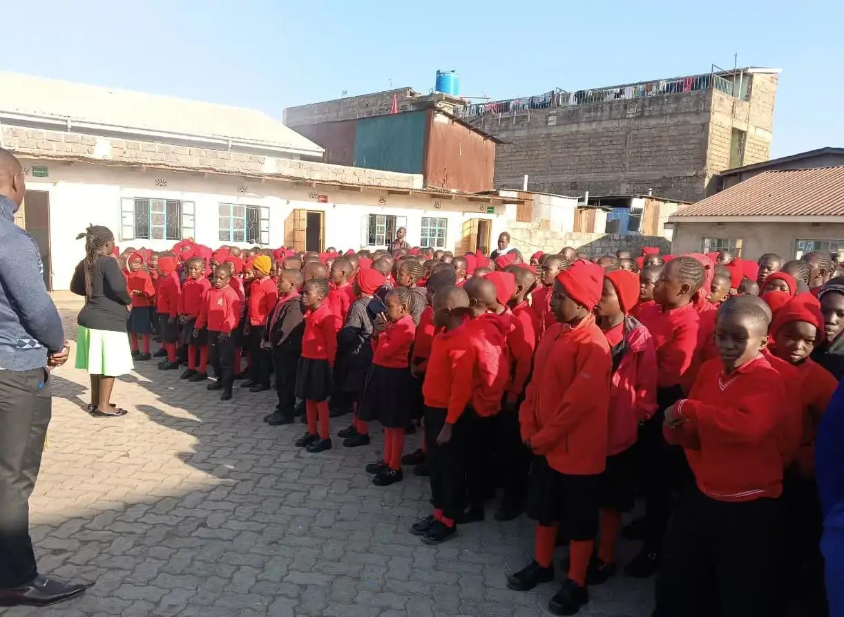 Pupils and teachers at morning assembly.