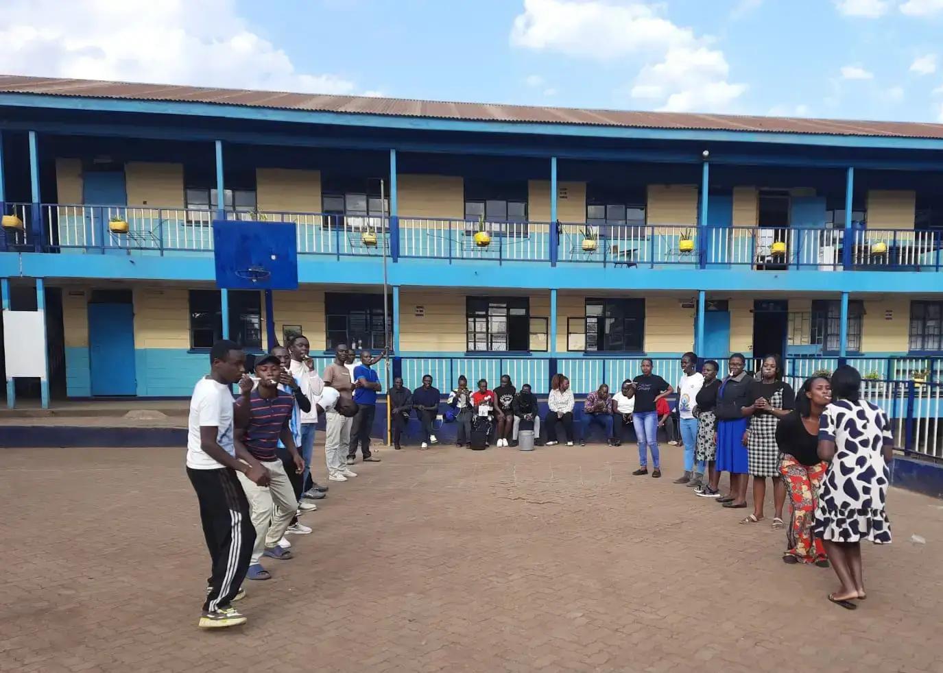 Members of the school community together in the courtyard.