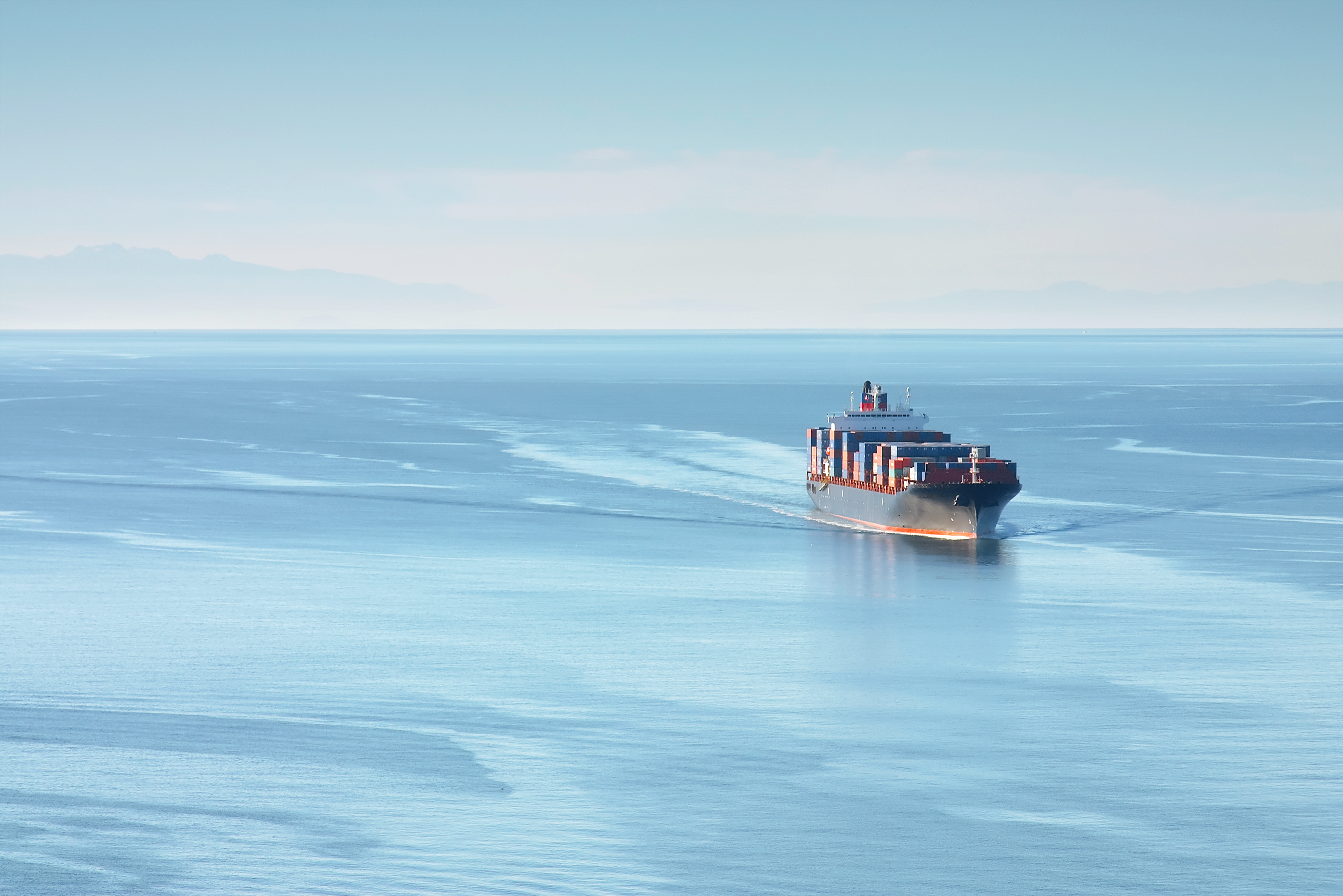 Container ship at port, an alternative to air freight